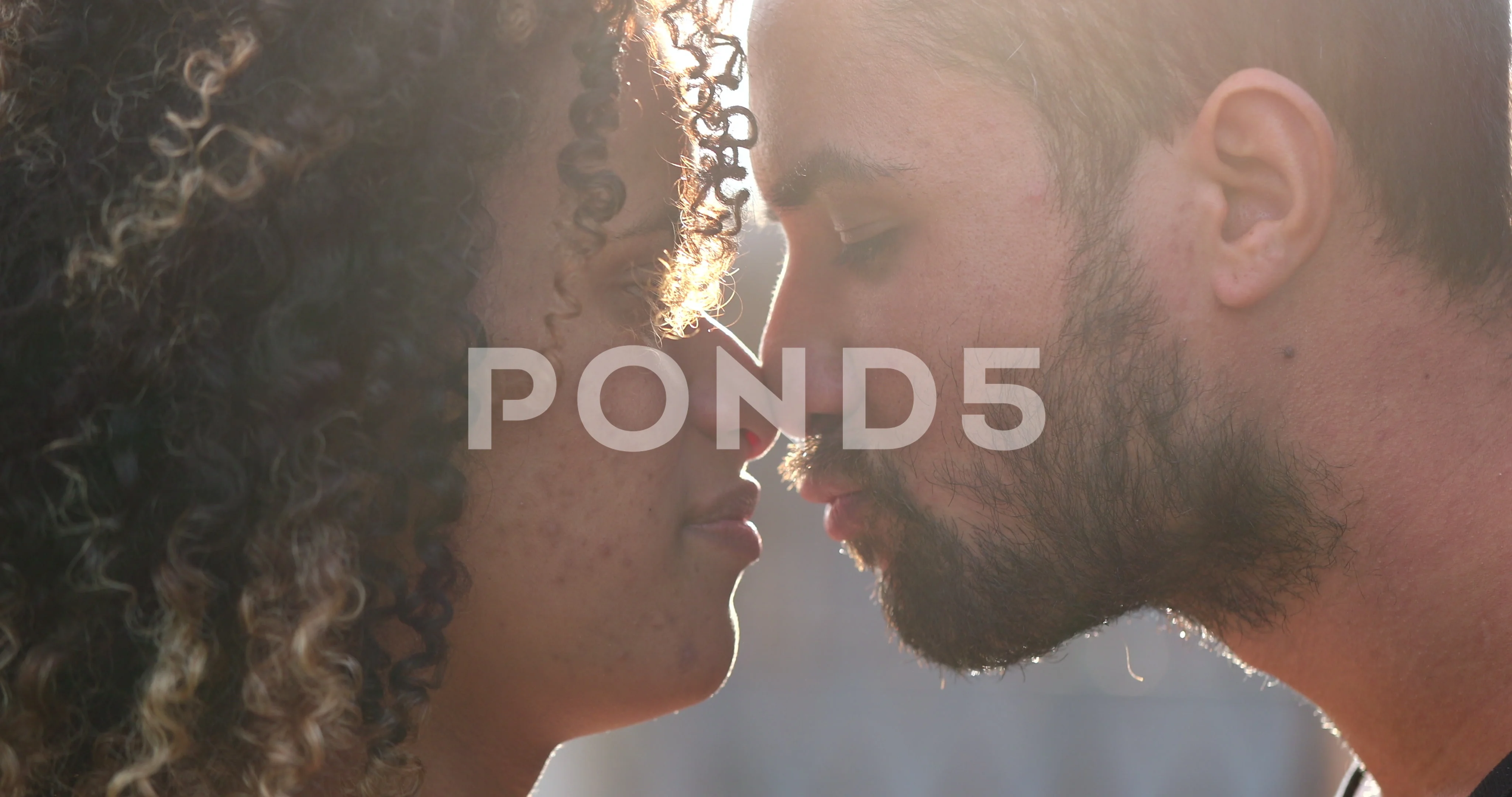 Loving hispanic black couple kissing, re..