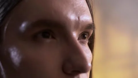 The loving look of a pensive cute guy with long hair. 動画素材 245617401