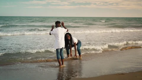 Loving mother embracing son on sandy beach while enjoy peaceful summer day... Stock Footage 337490142