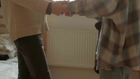 Loving pair carefully practicing dance in comfortable bedroom setting Stock Footage 325530895