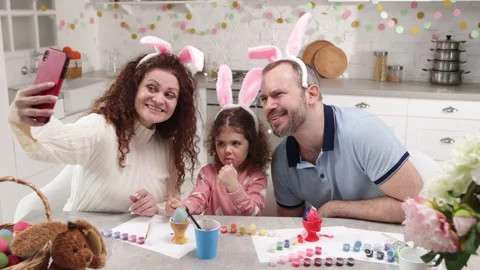 Loving parents creating memories while celebrating Easter holidays Stock Footage 234552078