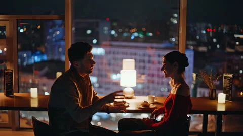 Loving people talking restaurant with night city view closeup. Bonding couple Stock Footage 340110384