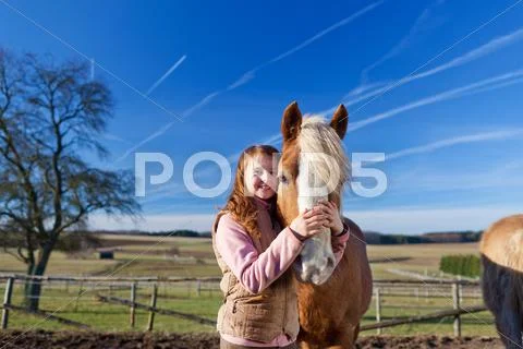 Loving portrait of a happy girl and her horse Stock Photos