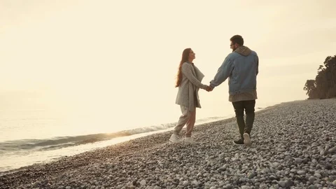 Loving spouses spend time on the beach in tenderness and care for each other Stock Footage 90035890