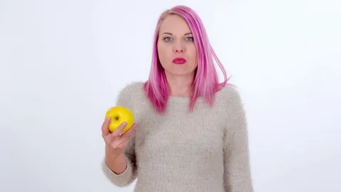 Loving the yellow apple Stock Footage 83724530