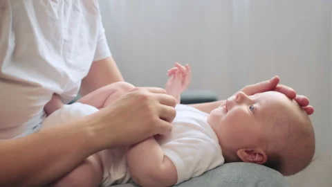 Loving young mother sit on sofa together with little child son Stock Footage 249263650