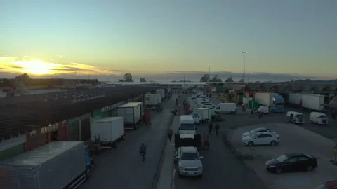 Low Aerial Along a Market Loading Lane at Sunrise Stock Footage 340535471