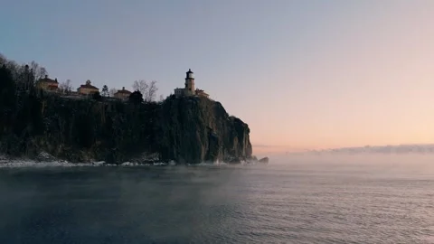 Low aerial approach over Lake Superior moving steadily toward the iconic Split Stock Footage 328660593