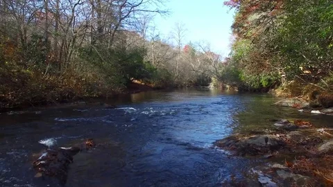Low Aerial Down River of Mountain Stream, 4K Stock Footage 71122769