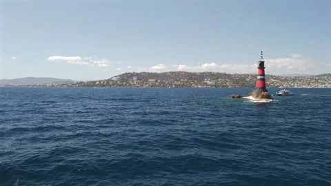Low aerial drone view flying over the sea near Fourmigue Antibes France. Stock Footage 344789887