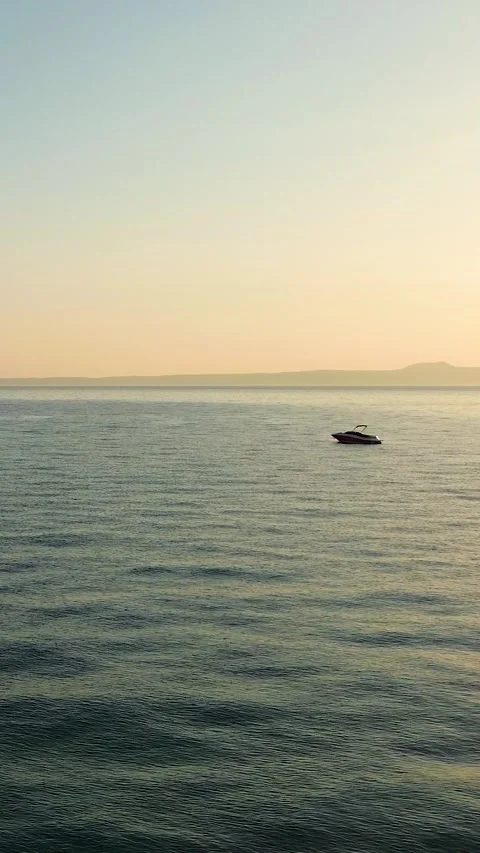 Low aerial flight over beach with stunning sunset sky in Greece Stock Footage 342238506