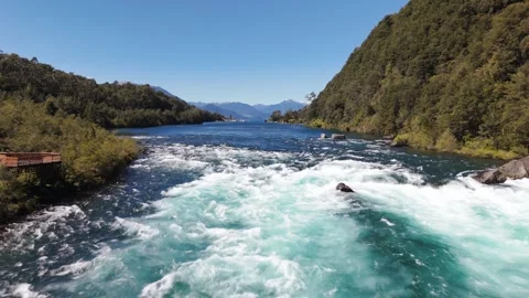 Low Aerial Flight Over Emerald Petrohue River Against Current with White Foam Stock Footage 325820141