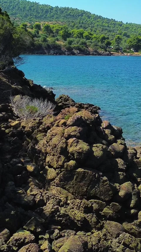 Low aerial flight over sea waves and coastal rocks in Greece Stock Footage 342238420