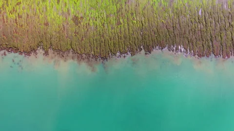 Low Aerial Flight Over Turquoise Water at Las Grutas, Argentina Stock Footage 346318895