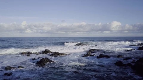 Low Aerial Fly Over Of Waves Crashing Over Rocks Stock Footage 84876847