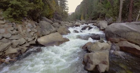 Low Aerial Flying Fast over Rushing River Stock Footage 76009434