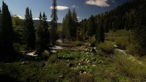 Low aerial over Logan River in north Utah in spring in mountains Stock Footage 277008161