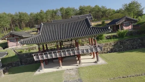 Low Aerial Roll Shot Flying Over Rooftop Into Korean Academy Courtyard Stock Footage 344369347