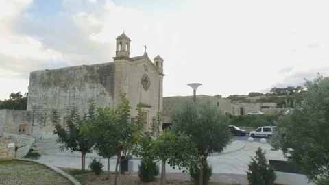 Low Aerial shot approaching St Matthew's Chapel in Qrendi Stock Footage 92085948