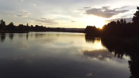 Low Aerial Shot of Bouncing Sunlight of beautiful River Stockbeeldmateriaal 61695365