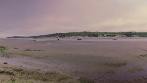 Low Aerial shot flying sideways over seashore in Wales Stock Footage 90496759