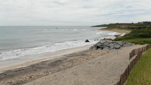 Low aerial of Squibnocket beach Martha's Vineyard on cloudy day Stock Footage 208828845