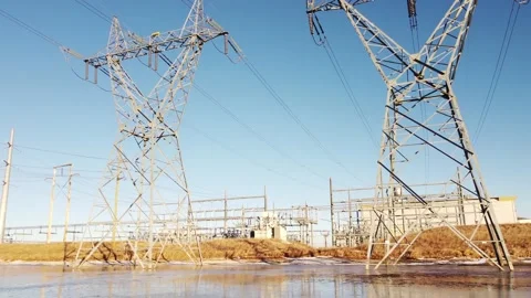 Low aerial tracking power lines and a natural gas generation plant Stock Footage 170262087