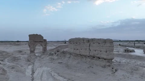 Low Aerial View of Ancient Mud Brick Arch and Rammed Earth Wall in Sijilmassa Stock Footage 345523755