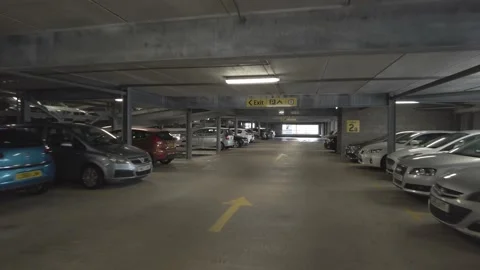 Low aerial view flying through a British car park Stock Footage 164732991