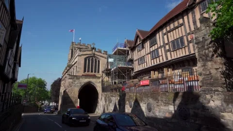Low aerial view of Lord Leycester hospital and West Gate in Warwick Stock Footage 243276875