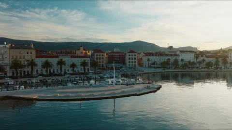 Low aerial view of Split waterfront and Republic Square at golden hour, Croatia Stock Footage 341674120
