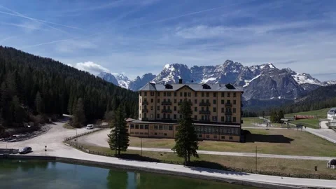Low Altitude Aerial Circular Push Over Water Orbiting Grand Mountain Lod Stock Footage 340867457