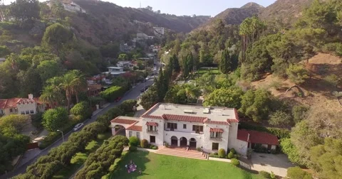 Low altitude aerial flight over historic Wattles Mansion in Los Angeles. 4K UHD Stock Footage