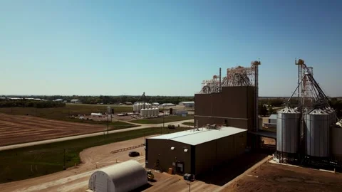 Low Altitude Aerial Flyby of a Farm Grain Elevator Business in the Midwest Stock Footage 274530341