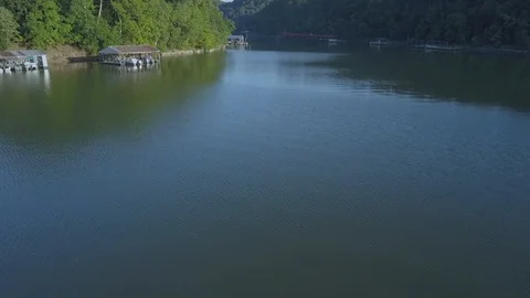 Low Altitude aerial view of rusty old boat house Stock Footage 108520700