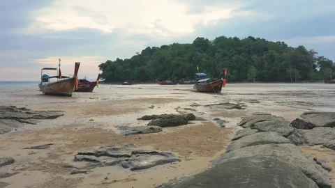 Low altitude drone between long tail traditional thai boats. Krabi, Thailand. Stock Footage 245977701