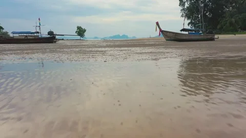 Low altitude drone between long tail traditional thai boats. Krabi, Thailand. Stock Footage 245977917