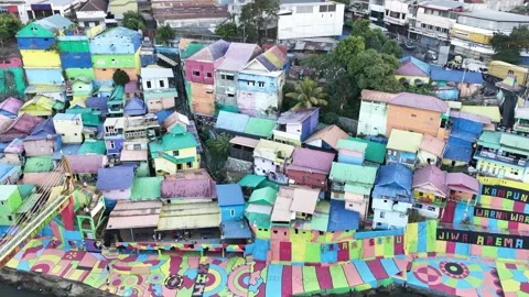Low Altitude Drone Flight Above Colorful Riverside Houses Stock Footage 340542667
