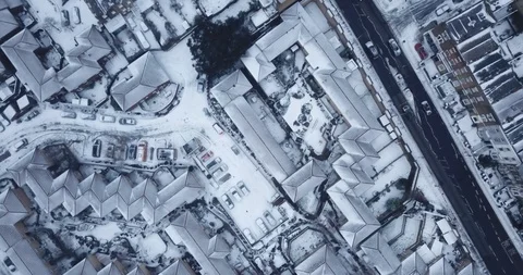 Low altitude drone flight over London during a rare snowstorm in March, 2018. Stock Footage 86564587