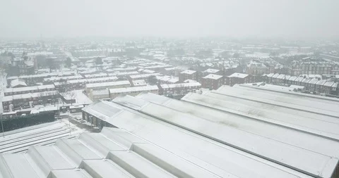 Low altitude drone flight over South West London during a snowstorm. Stock Footage 87168372