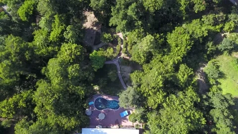 Low altitude drone flight over a green neighborhood. Stock Footage 134911262