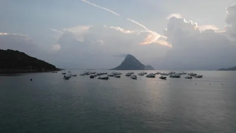 Low-altitude drone flight over anchored boats near Tavolara Island in Sardinia Stock Footage 289462622