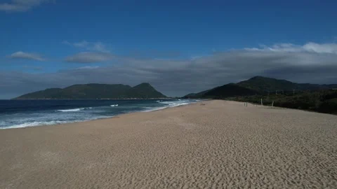 Low-Altitude Drone Flight Over Armação Beach, Florianópolis Stock Footage 309487087