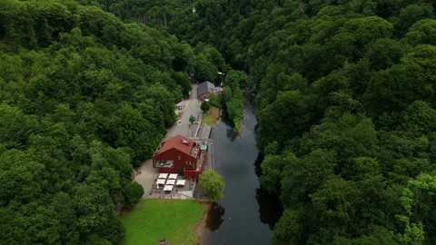 Low Altitude Drone Flight Over Wupper River with Greenery and Buildings Germany Stock Footage 312531134