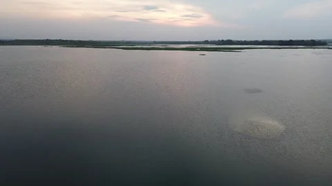 Low Altitude Drone Flight Over Still Reservoir Reflecting Morning Clouds Stock Footage 313932819