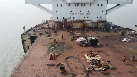 Low Altitude Drone Flight Over Dismantled Ship Deck at a Shipbreaking Yard Stock Footage 327168117