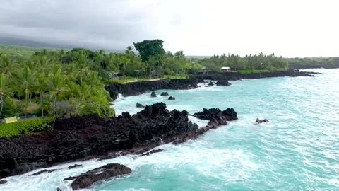 Low-Altitude Drone Flight Over Volcanic Coastline and Peaceful Seaside Stock Footage 328387911