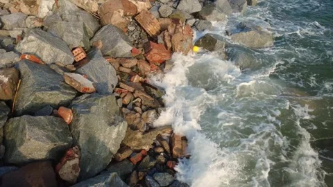 Low Altitude Drone Flight Over Coastal Rocks with Gentle Waves Video stock 330363068