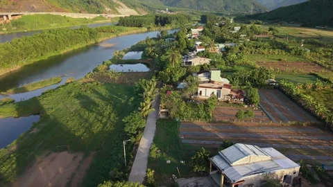 Low altitude drone flight over rural riverside village in Da Nang Vietnam Stock Footage 337867637