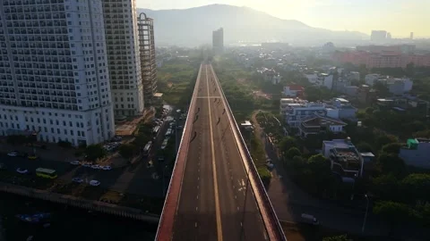 Low altitude drone flight over bridge at sunrise in Da Nang, Vietnam Stock Footage 340874454